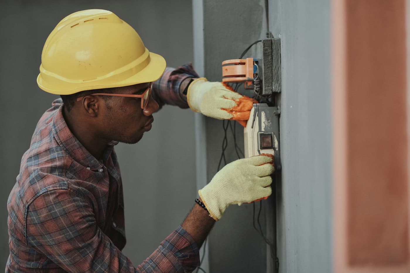 Electrician installing an electrical fixture